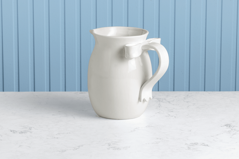 White Bow Pitcher | Sculpted Handle Ceramic Design | Mud Pie